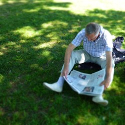 #Father resting  #press #newspaper #shadow #grass #green #man
