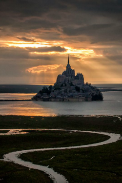 kitty-in-training:  ilaurens: The heaven light over the Mont Saint-Michel - By: Mathieu RIVRIN  This was the most beautiful place I’ve ever visited!   On my bucket list BIG time