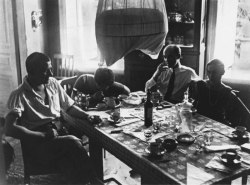 barcarole:    Vladimir Mayakovsky, Varvara Stepanova, Osip Beskin and Lilya Brik sitting at a table in 1926. Photo by Alexander Rodchenko.  