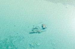 discoverynews:  Coast Guard Aircraft Spots 100-Year-Old ShipwrecksA helicopter from the U.S. Coast Guard’s Traverse City, Mich. station was on a routine patrol mission over northern Lake Michigan Friday, when crew members noticed a chilling sight.Beneath
