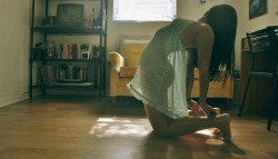 thisbody:  asleepylioness:   Being in the sun makes me feel alive, energized, perhaps a little powerful. Even in front of a window, those little specks of light turn a boring floor into a piece of art. With this picture in particular, the way the light