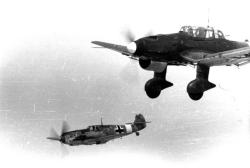 historicaltimes:A Messerschmitt Bf 109 escorts a Junkers Ju 87 “Stuka” across the Mediterranean Sea, towards Malta. Circa 1940-1942. via reddit