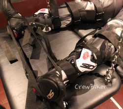  Rubbernaut was strapped down to the bondage table and hinted that he could still move his legs.  A few carefully placed straps on the boots completely immobilized him. 