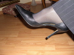 I am more than willing to worship her pantyhosed feet and black heels. 