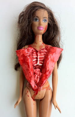 laggycreations:  My art teacher says I’m playing with barbies wrong. Made this for sculpture class using a thrift store barbie, air dry clay, acrylic paint, and lots of gloss. 