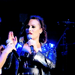  Demi trying to fix a broken mic.   Oh sooo