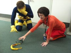 strippersandclits:  daggerpen:   Image Caption: A picture of two cosplayers, one cosplaying Velma from Scooby Doo and one cosplaying Cyclops from the X-Men. Both kneel on the floor groping around with their hands; Cyclops covers his eyes, while Velma