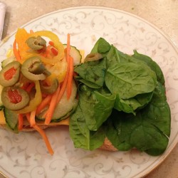 Hummus veggie sandwich for dinner! #yum #hummus #greenolives #spinach #bananapepper #Cucumber #dinner #carrots #onions #mustard