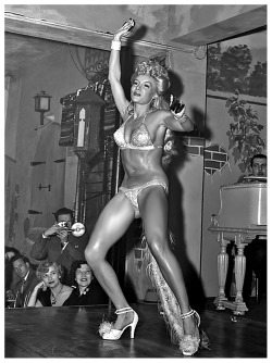 burleskateer:Lilly “The Cat Girl” Christine performs her routine on stage at ‘Prima’s 500 Club’ in New Orleans, sometime during the mid-1950’s..  Check out the claws on her fingers!
