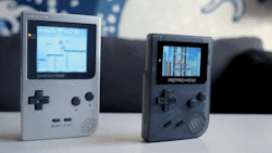 shutupandtakemymonies:   The Retromini (Retro mini) is a handheld console which can play GB, GBC, GBA and NES Games. At only 103. grams with the battery, it is lightweight and extremely portable.   It has L+R triggers for GBA games and includes 508 Games