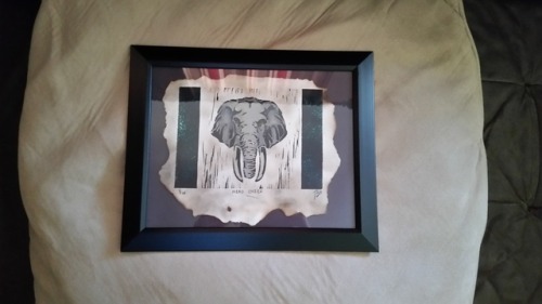 Printmaking papr burned with lighter, Printmaking from linoleum block of elephant head, then watercolor paint to give it a little extra detail with color,it’s a gift for my grandmother!!!!