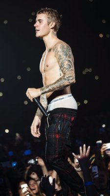 biebsblogger2: Strutting on stage, showing off his bare chest and sagging his perfect butt.