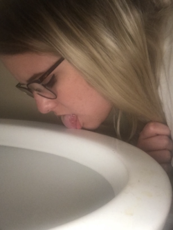 mostlyshy:20 Year Old licking the toilet, showing off her big tits and hairy pussy in a public restroom and behaving like a pig with a taped nose and degrading body writing. Oh, and spit. 