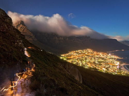 natgeotravel:  Vibrant Cape Town glows below Lion’s Head and Twelve Apostles on South Africa’s coast. See this photo and more travel frames on Travel 365 » Photograph by Heiko Meyer, laif/Redux