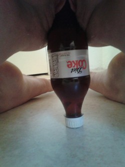 wiganswinget:  goodgirl2011:  This coke bottle has been giving me nightmares. Last time I tried it ended in complete disappointment and a feeling of failure. Even crying. That was not going to happen again. He told me to loosen my cunt a bit with the