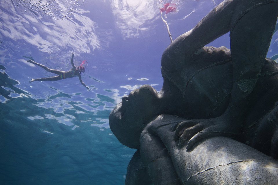 sixpenceee:  This 18-foot-tall female Ocean Atlas sculpture can be found off the