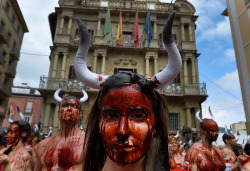 yahoonewsphotos:  Photos of the day - July 5, 2016 Animal rights protesters covered in fake blood demonstrate for the  abolition of bull runs and bullfights a day before the start of the  famous running of the bulls San Fermin festival in Pamplona; A