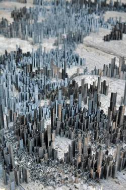 sixpenceee:  A city made of staplesBy artist Peter Root. Stacks of staples were broken into varying sizes from full stacks about  12cm high down to single staples. These stacks were then stood up and  arranged over a period of 40 hours.