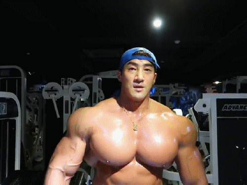 muscleobsessive:Chul Soon, popping out those sweaty monster pecs, delts and lats. Big soaking wet bounce-house fucktoy.
