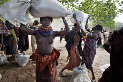   Ethiopia’s Omo Valley, by Olson and Farlow    Food aid hand out in the Nyangatom town called Kangaten: After the government brings an end to flood recession agriculture by putting the Gibe III dam online, the only other ways these tribes can feed