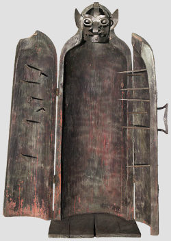 archaicwonder:  Iron Maiden with inscription, dated 1593, Austria Carved in one piece, a sarcrophagus-like hollowed tree trunk with shaped shoulders and two folding doors. There are nailed iron bands on the head with a hinged iron mask of riveted clasps