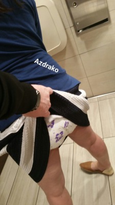 azdrako:  I forced baby cat into the family restroom and pulled up her skirt. Her response was “daddy I has an accident but it’s ok i brought more diapers”. I felt her warm wet diaper and kissed her and layed her on the counter and began to change