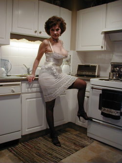 womenofasimilaragetoo:  As he walked into the kitchen and saw Ruth dressed like this, Marty knew there would be no dinner tonight……….but he was ok with that.