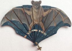 the-unicorns-of-nienna:  treasures-and-beauty:  Hand painted, exceptionally rare miniature  bat fan.  On thin shaved wood.  Circa 1900.      [Image Description: a handheld wooden fan featuring a bat with outstretched wings on a night sky background.]