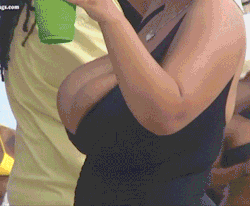 Rihanna was so drunk that she didnâ€™t realize that she was having a reaction to her drink - slowly, her tits grew in her dress, spilling out the top until they were huge and out on display.