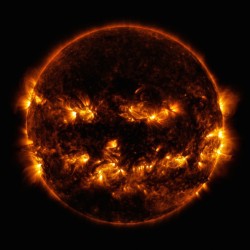 mothernaturenetwork:  The sun flashes jack-o’-lantern grin in this uncanny NASA photoA haunting face reminiscent of a carved jack-o’-lantern emerges from the active regions of the sun’s corona in this image captured on Oct. 8 by NASA’s Solar Dynamics