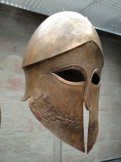 dolce-vita-lifestyle:  lucienballard:  Corinthian helmet. Corinthian helmet from the tomb of Denda. The name of the warrior (Denda) is engraved on the left greave. From a Greek workshop in South Italy, 500–490 BC. Source: Staatliche Antikensammlungen.