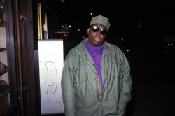 This picture of Notorious B.I.G was taken long before the fame and wealth. A very humbly dressed Christopher Wallace standing in front of a bodega on Fulton avenue in Bedford Stuyvesant Brooklyn in 1992. Green army jacket, green army hat free sunglasses