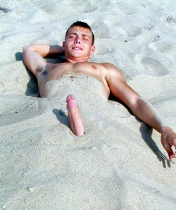 bareandshare:  Cock poking out of sand at beach 