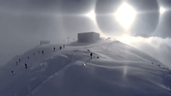 theboywhocan11:  sixpenceee:  This is a gif of a sun halo. They are formed around the Sun due to moisture, in this case ice crystals, being refracted from the Sun’s rays in the upper atmosphere.  It is so unreal. 