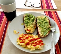 veggieviebyiulesandt:  Fuel for my long days: whole grain toast with hummus and smashed avocado (drizzled with olive oil and lemon), two scrambled eggs (in coconut oil) with hot sauce, paired with a cup of coffee. 
