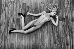 nude on hardwood floor by John Deckard