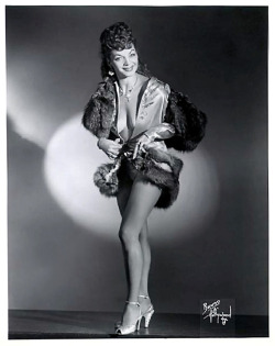 Trudine      aka. “The Quiver Queen”.. A reliable Feature dancer who performed regularly on the Hirst circuit of Burlesk theatres.. She liked to travel from venue-to-venue in her Buick roadster.. Her sole companion on these trips was a French
