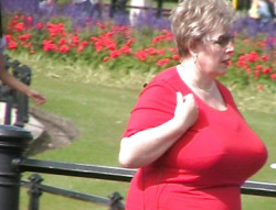 Older lady fully clothed but showing an absolutely MASSIVE set of breasts!Find your big breasted old lady here!