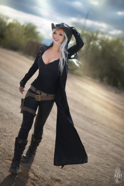 steamgirlofficial:  The Woman in Black. Kato, catching a breeze before a storm blew in at Wild Wild West Con this past Sunday. She designed and made her outfit, and rumor has it - you just might be able to purchase one of those sexy dusters for yourself