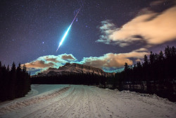 ohstarstuff: While out hunting for the aurora borealis this December, astrophotographer Brett Abernethy captured this incredible meteor fireball streaking across the sky near Johnson Lake in Banff National Park, Canada. 