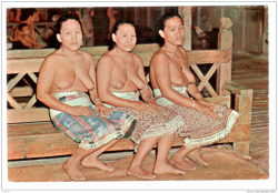 Via DelcampeSea Dayak Maidens, Kuching/Sarawak. Picture shows three Sea Dayak maidens sitting inside the Long House