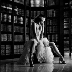 firefly-flashes:&ldquo;Where are we?” she asked nervously as he guided her to as seat, not removing the blindfold.“Guess,” he said.She took a deep breath, the smell of old books and lemony floor polish making her smile. “The library.” Her hands