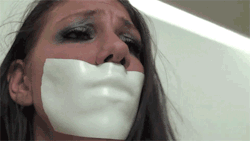 gagged4life:  Some tape gag fans aren’t too keen on microfoam tape because they don’t like the big lip imprint it leaves when used as a gag, kind of nullifying the whole “erase your mouth” aspect of a tape gag. I can appreciate that, but speaking