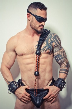 bikepup:  intheroughhouse:   For guys into leather, follow me at: intheroughhouse.tumblr.com   Hot an sexy  I totally know what I&rsquo;d be doing with those wrist restraints&hellip; :) Up on the wall and flog the fuck out of him&hellip; 