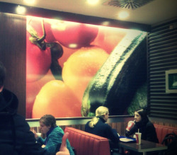 thesnakeandtherabbit:  I took this snapshot with my phone the other day… This is the wall decor of our McDonalds… Somehow that yellow pepper looks like a very yellow ass from above. The stem makes it look like it’s getting a hard ass fucking by