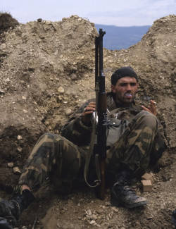 gunrunnerhell:  Smoke break… Most likely a rebel fighter during the Yugoslav Wars back in the 90’s. Note the M72 RPK with it’s distinct heavy barrel with cooling fins. Many of demilled parts kits that arrived into the U.S from these conflicts were
