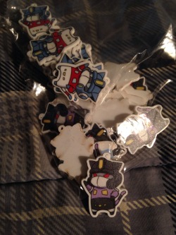 eikuuhyoart:  The restock of Optikitty charms and the Botcon special SG Opticat charms came today! Time to peel the protective paper on the back and start packaging :3