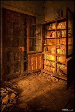 Books decaying on shelves in an abandoned castle in Spain. Love the light!