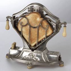 godoftimedeus: viridiansun:  koobaxion:  steampunktendencies: An Electric Toaster circa 1920 this looks like some shit out of dishonored  Bad and naughty bread is put into the TOAST PRISON to atone for its crimes   I love this so much!!! I want one  