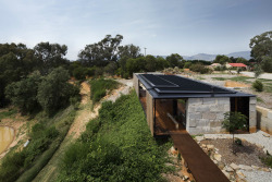 cjwho:  SawMill House, Australia by Archier Studio |via  From the architect: The Sawmill House uses large reclaimed one tonne blocks of reclaimed concrete which anchor it into the landscape and a dynamic active building envelope to regulate the internal